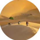 Man walking over the sand dunes